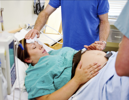 Pregnant lady giving birth
